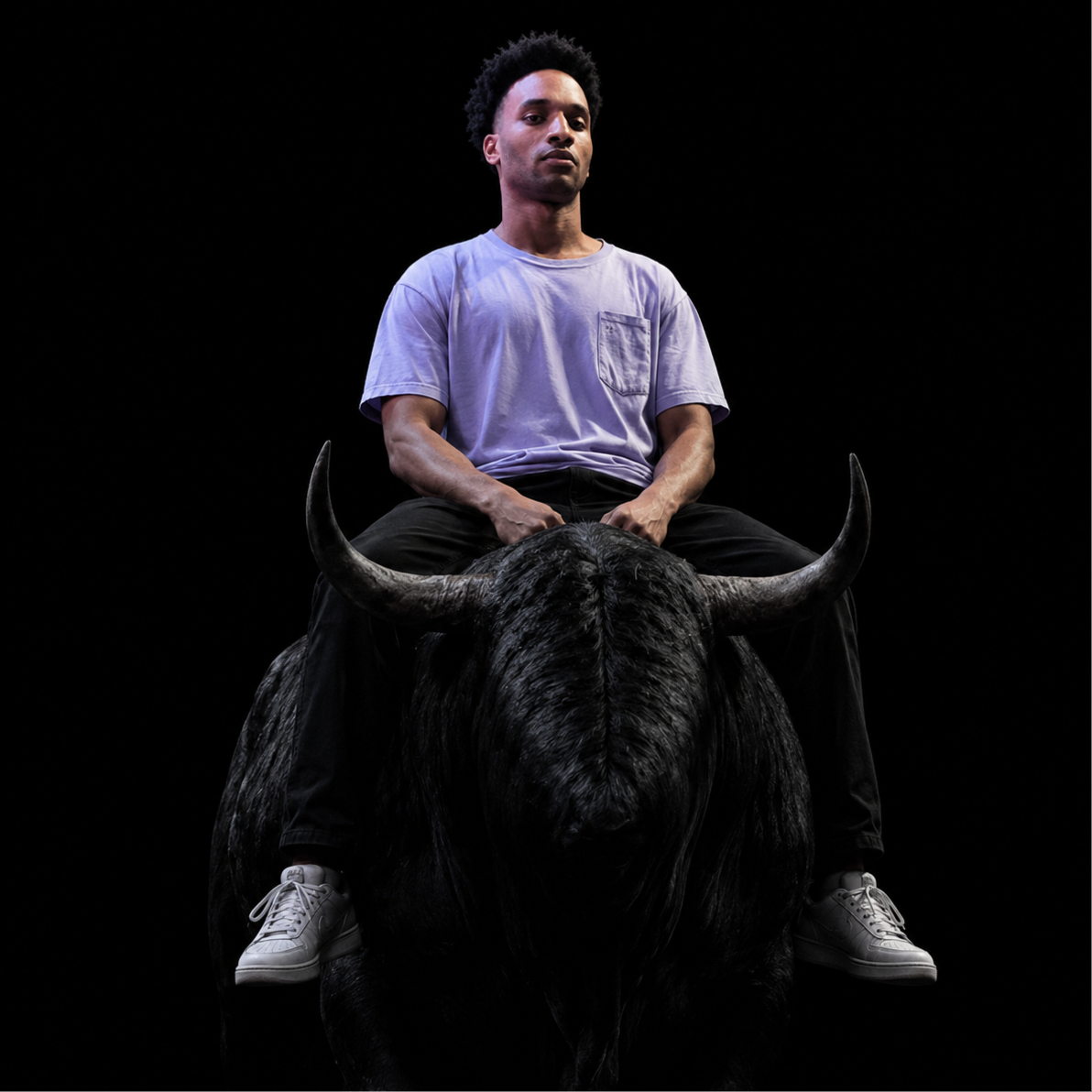 close portrait of the rider on the black bull